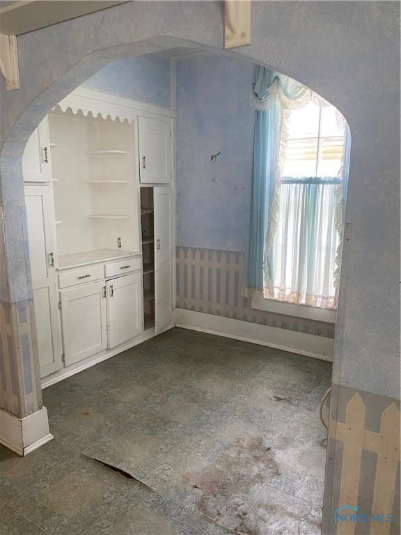 232 N Franklin St, Wauseon, OH 43567 - unfurnished dining area with arched walkways