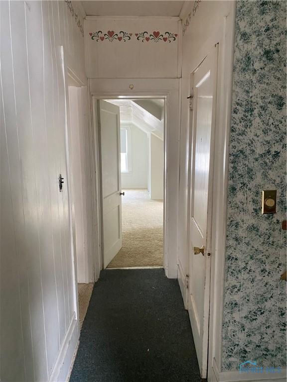 232 N Franklin St, Wauseon, OH 43567 - hallway featuring dark colored carpet