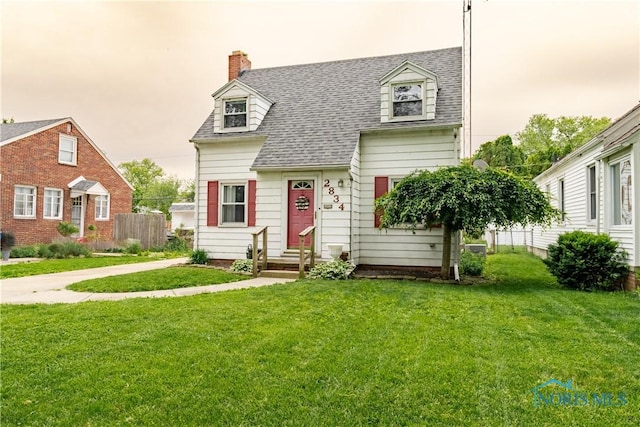 2834 123rd St, Toledo, OH 43611 - new england style home featuring a shingled roof and a chimney