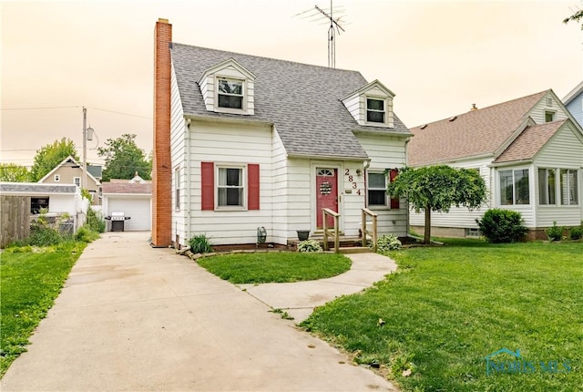 2834 123rd St, Toledo, OH 43611 - cape cod home featuring entry steps, a front yard, an outbuilding, a shingled roof, and a chimney