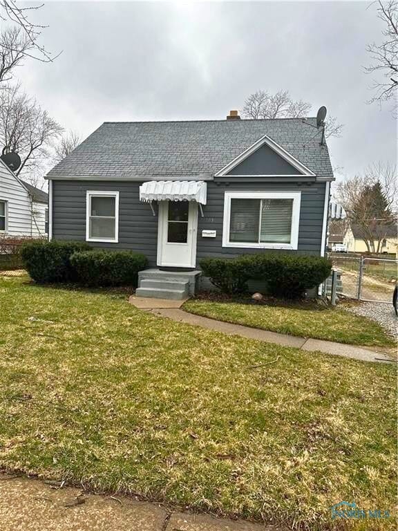 803 Turner Ave, Toledo, OH 43607 - bungalow featuring a shingled roof and a chimney