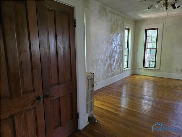 336 Holgate Ave, Defiance, OH 43512 - unfurnished living room with a ceiling fan, hardwood / wood-style floors, and ornamental molding
