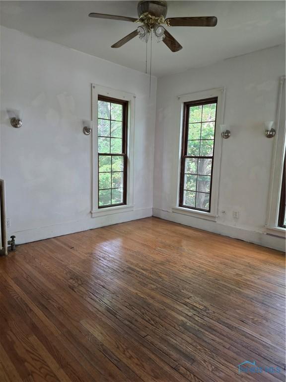 336 Holgate Ave, Defiance, OH 43512 - unfurnished room with healthy amount of natural light and wood finished floors