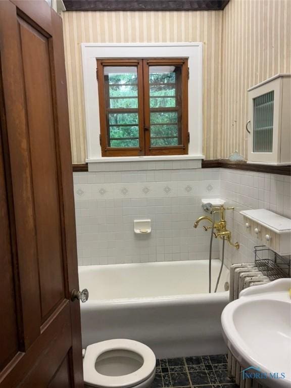 336 Holgate Ave, Defiance, OH 43512 - bathroom with a bathtub, tile patterned flooring, and wallpapered walls