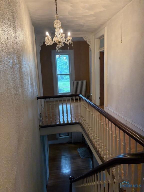 336 Holgate Ave, Defiance, OH 43512 - staircase with a chandelier and wood finished floors
