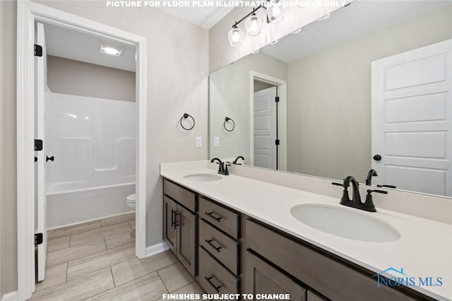 160 Bentley Dr, Perrysburg, OH 43551 - bathroom with toilet, double vanity, tub / shower combination, and baseboards