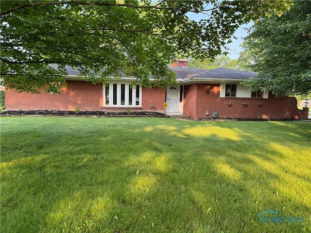 2102 Glen Arbor Dr, Toledo, OH 43614 - ranch-style house featuring brick siding, a front lawn, and a chimney