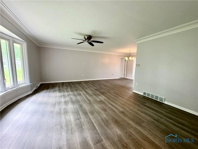 2102 Glen Arbor Dr, Toledo, OH 43614 - empty room with a chandelier, a ceiling fan, dark wood-type flooring, baseboards, and ornamental molding