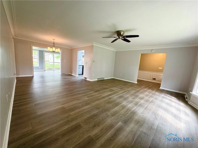2102 Glen Arbor Dr, Toledo, OH 43614 - unfurnished living room with dark wood-style floors, ornamental molding, a chandelier, ceiling fan, and baseboards