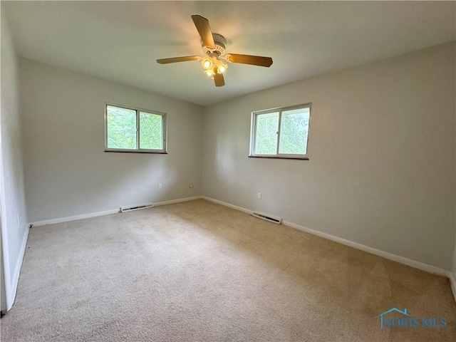2102 Glen Arbor Dr, Toledo, OH 43614 - carpeted empty room with healthy amount of natural light, baseboards, and ceiling fan