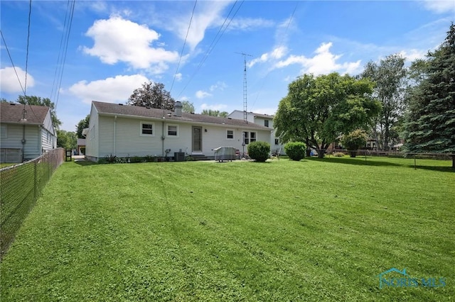 864 Maple Ln, Waterville, OH 43566 - rear view of house with a fenced backyard