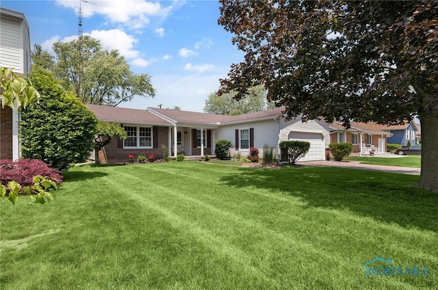 864 Maple Ln, Waterville, OH 43566 - single story home with an attached garage, a front yard, driveway, and brick siding