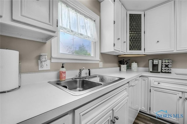 864 Maple Ln, Waterville, OH 43566 - kitchen with white cabinets, light countertops, and white dishwasher