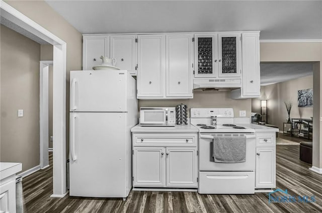 864 Maple Ln, Waterville, OH 43566 - kitchen with white appliances, under cabinet range hood, dark wood-style floors, white cabinets, and light countertops