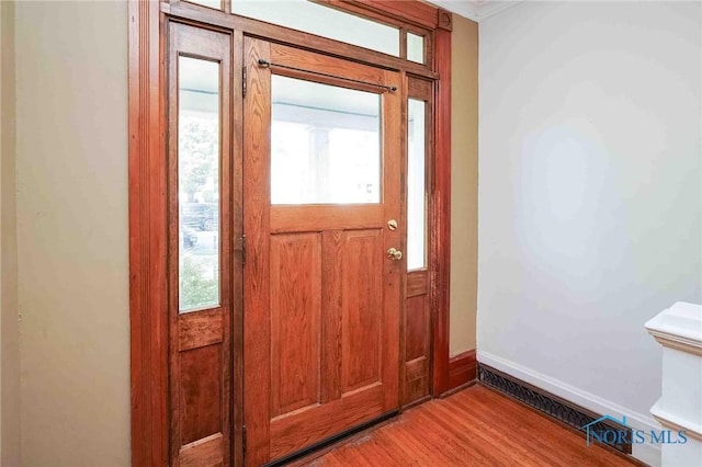 117 3rd St, Findlay, OH 45840 - entryway with light wood-type flooring, baseboards, and ornamental molding