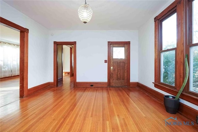 117 3rd St, Findlay, OH 45840 - foyer featuring light wood-style floors, baseboards, and a chandelier