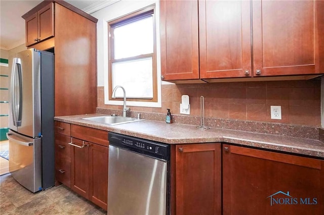 117 3rd St, Findlay, OH 45840 - kitchen with stainless steel appliances, a sink, brown cabinetry, decorative backsplash, and crown molding