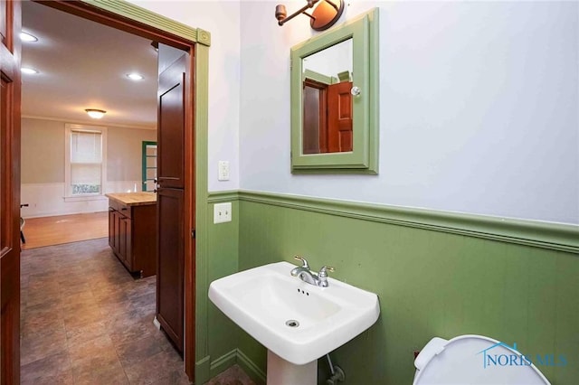 117 3rd St, Findlay, OH 45840 - half bath with a wainscoted wall, a sink, recessed lighting, ornamental molding, and toilet