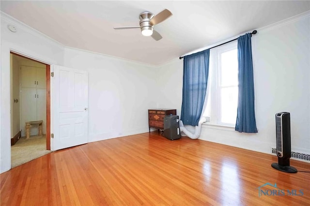 117 3rd St, Findlay, OH 45840 - spare room featuring ceiling fan, light wood-style floors, and crown molding