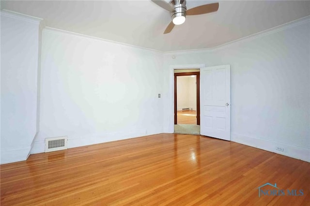 117 3rd St, Findlay, OH 45840 - empty room featuring a ceiling fan, ornamental molding, and wood finished floors