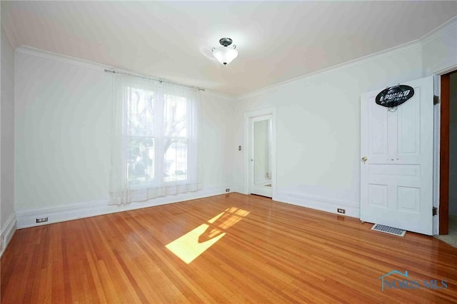117 3rd St, Findlay, OH 45840 - empty room featuring baseboards, wood finished floors, and crown molding