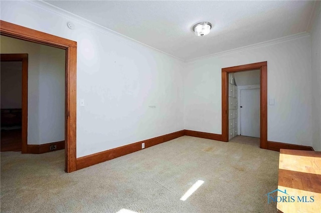 117 3rd St, Findlay, OH 45840 - spare room featuring crown molding, carpet floors, and baseboards