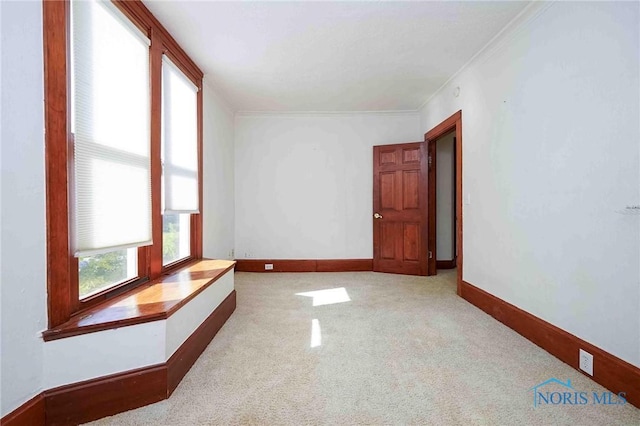117 3rd St, Findlay, OH 45840 - carpeted empty room with crown molding and baseboards