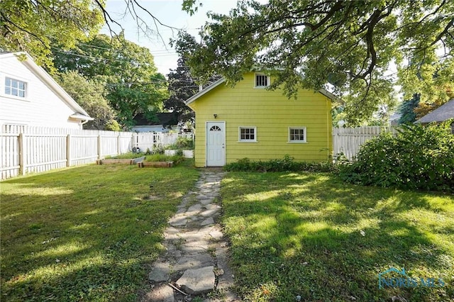 117 3rd St, Findlay, OH 45840 - back of house with a vegetable garden