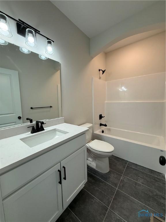 670 Rdg Lake Ct, Perrysburg, OH 43551 - bathroom with tile patterned floors, vanity, toilet, and tub / shower combination