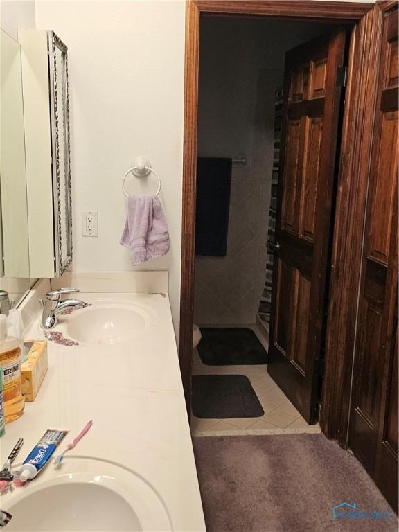 110 Harbor Point Rd, Rossford, OH 43460 - bathroom with double vanity and tile patterned flooring
