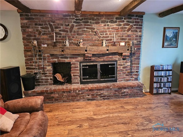 110 Harbor Point Rd, Rossford, OH 43460 - living area with beamed ceiling, a brick fireplace, and wood finished floors