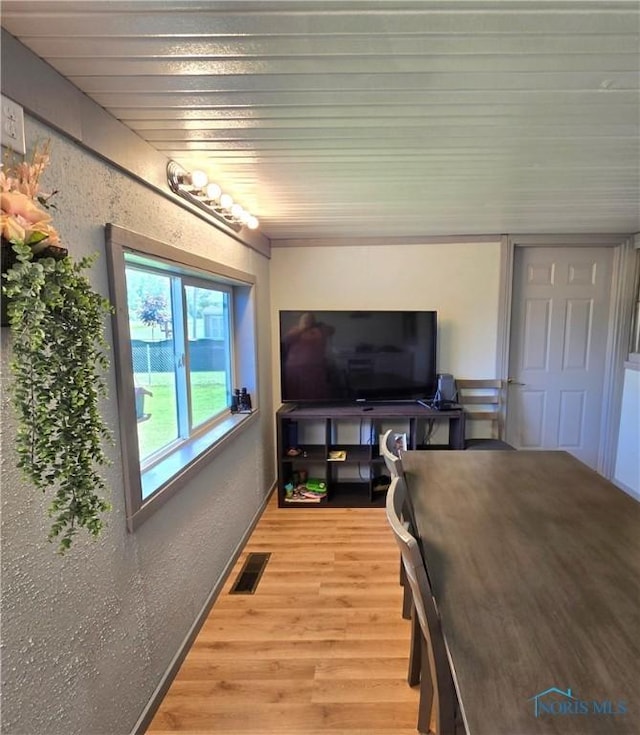 1154 Lagrange St, Napoleon, OH 43545 - dining room with light wood-style floors and a textured wall