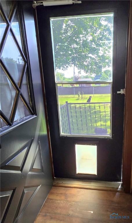 1154 Lagrange St, Napoleon, OH 43545 - doorway to outside featuring wood finished floors