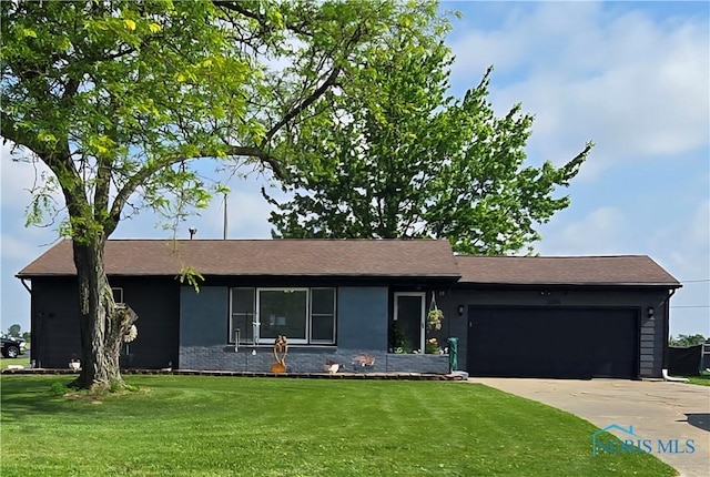 1154 Lagrange St, Napoleon, OH 43545 - view of front of property featuring an attached garage, a front yard, and concrete driveway