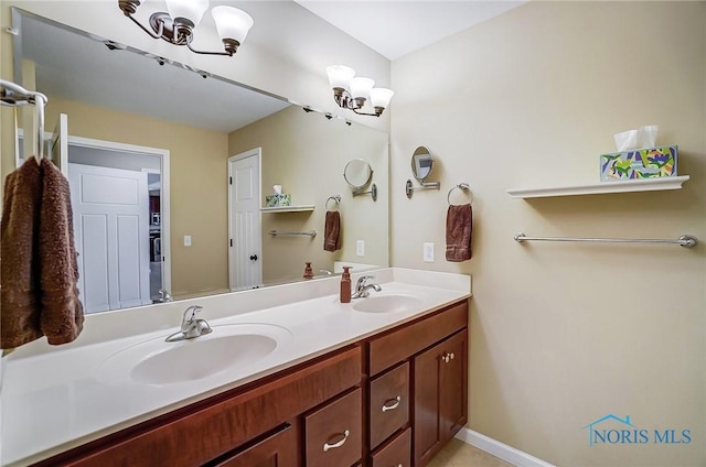 8971 N Park Lake Cir, Sylvania, OH 43560 - bathroom with a chandelier and double vanity