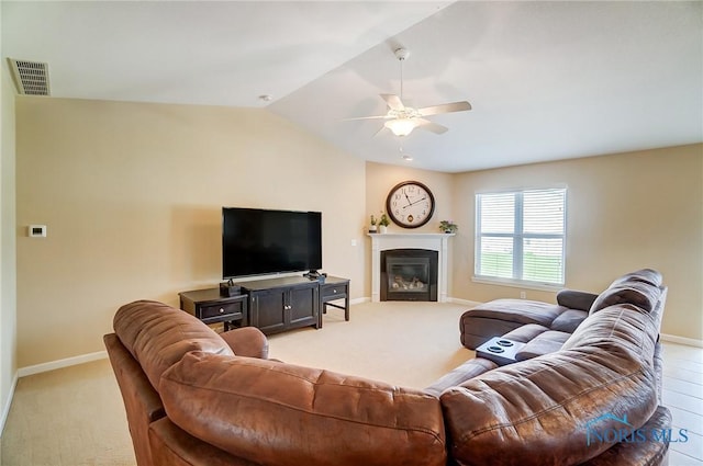 8971 N Park Lake Cir, Sylvania, OH 43560 - living room with a ceiling fan, lofted ceiling, light colored carpet, and a glass covered fireplace