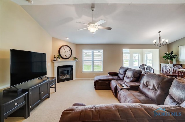 8971 N Park Lake Cir, Sylvania, OH 43560 - living room with light colored carpet, a chandelier, a ceiling fan, and a glass covered fireplace