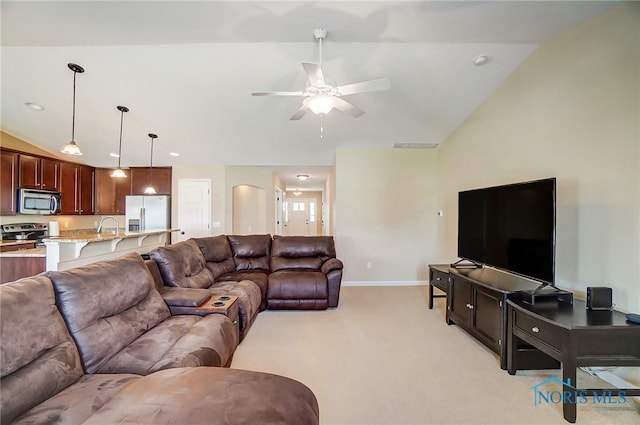 8971 N Park Lake Cir, Sylvania, OH 43560 - living room with lofted ceiling, ceiling fan, and light colored carpet