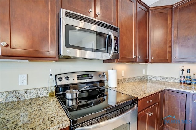 8971 N Park Lake Cir, Sylvania, OH 43560 - kitchen with appliances with stainless steel finishes and light stone countertops