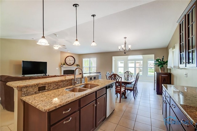 8971 N Park Lake Cir, Sylvania, OH 43560 - kitchen featuring a fireplace, pendant lighting, open floor plan, dishwasher, and lofted ceiling