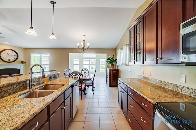 8971 N Park Lake Cir, Sylvania, OH 43560 - kitchen with pendant lighting, glass insert cabinets, stainless steel appliances, light stone counters, and light tile patterned floors