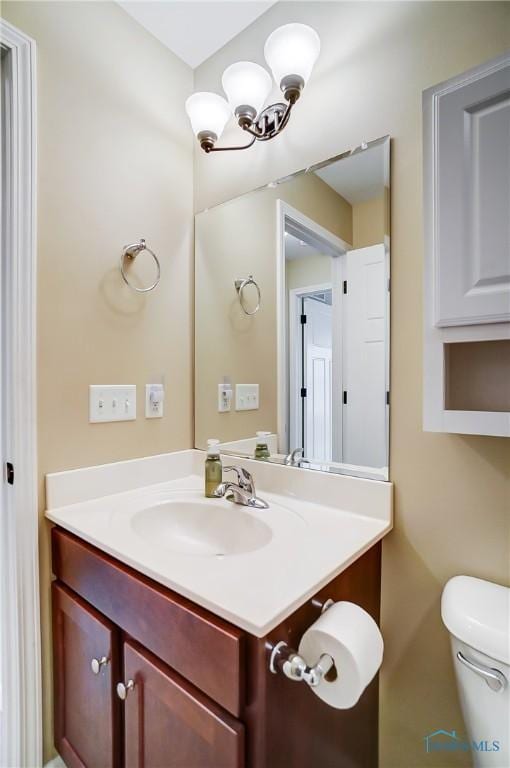 8971 N Park Lake Cir, Sylvania, OH 43560 - half bathroom featuring vanity and toilet