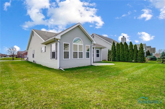 8971 N Park Lake Cir, Sylvania, OH 43560 - rear view of house with a yard