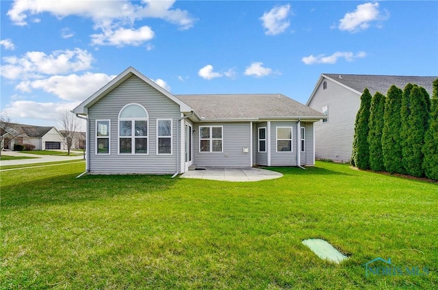 8971 N Park Lake Cir, Sylvania, OH 43560 - rear view of house with a patio, a yard, and roof with shingles