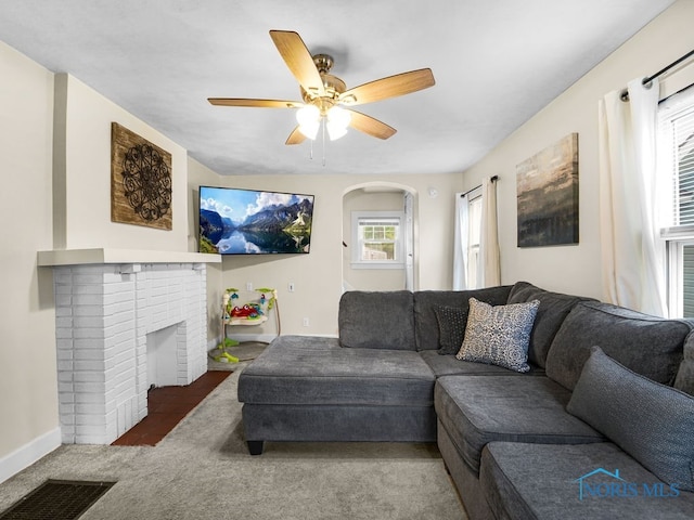 2238 Oak Grove Pl, Toledo, OH 43613 - living area with a ceiling fan, baseboards, carpet flooring, and a fireplace