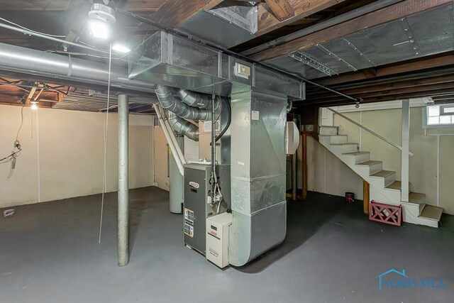 4405 Vermaas Ave, Toledo, OH 43612 - basement featuring heating unit and stairway