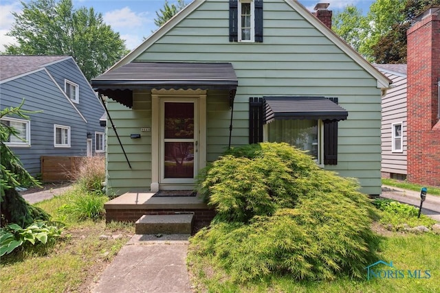 3643 Kershaw Ave, Toledo, OH 43613 - bungalow-style house featuring a chimney