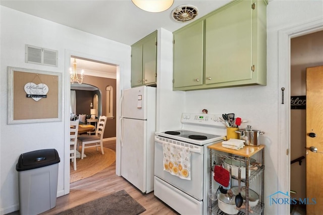 3643 Kershaw Ave, Toledo, OH 43613 - kitchen with green cabinets, white appliances, arched walkways, light wood-style flooring, and a chandelier