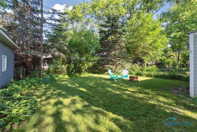 3643 Kershaw Ave, Toledo, OH 43613 - view of yard featuring an outdoor fire pit
