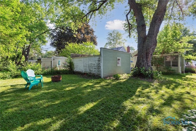 3643 Kershaw Ave, Toledo, OH 43613 - view of yard featuring an outdoor fire pit and an outbuilding